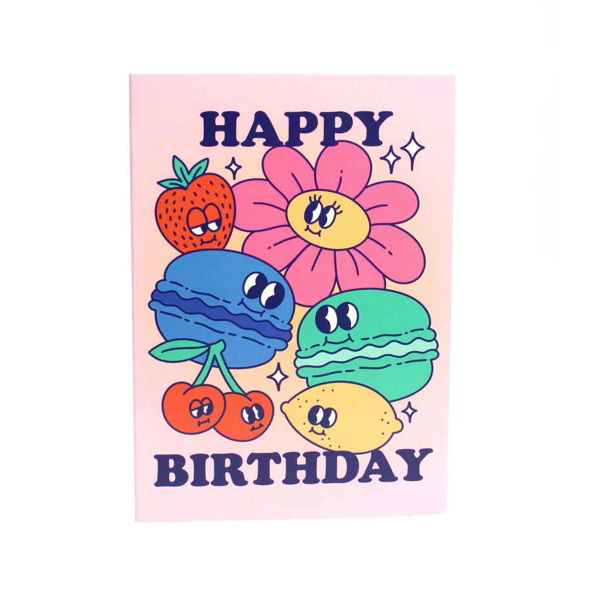 Pink card with colour illustrations of cartoon macarons, fruits and flowers with the text 'happy birthday'