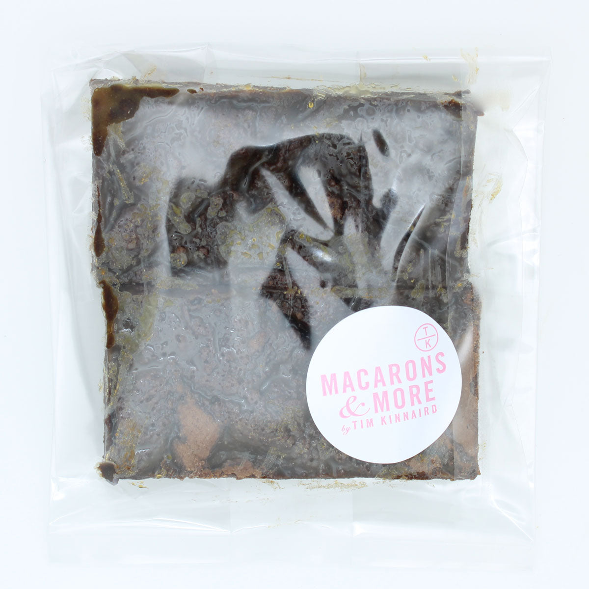 Packaged salted caramel brownies with a 'Macarons & More' label on a white background