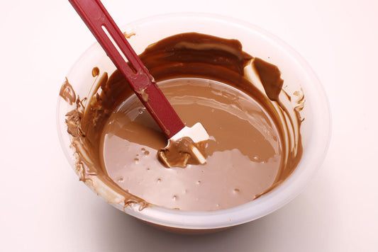 A bowl of tempered melted chocolate