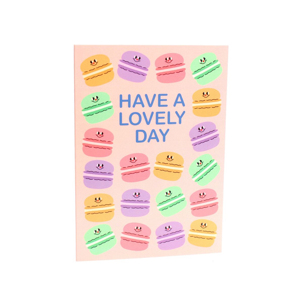 Greeting card with colourful macaron illustrations on a pink background and 'Have a Lovely Day'