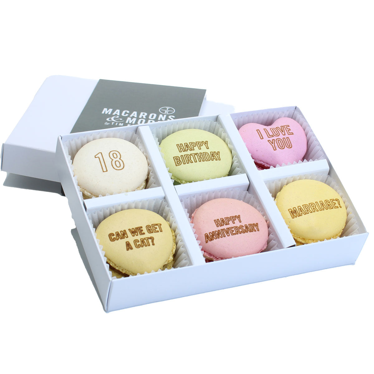 Box of personalised branded macarons in a white box with Macarons & More branding.