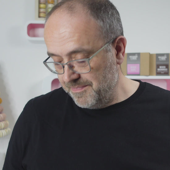 A video of Tim Kinnaird holding each macaron flavour up to show off their colours and designs.